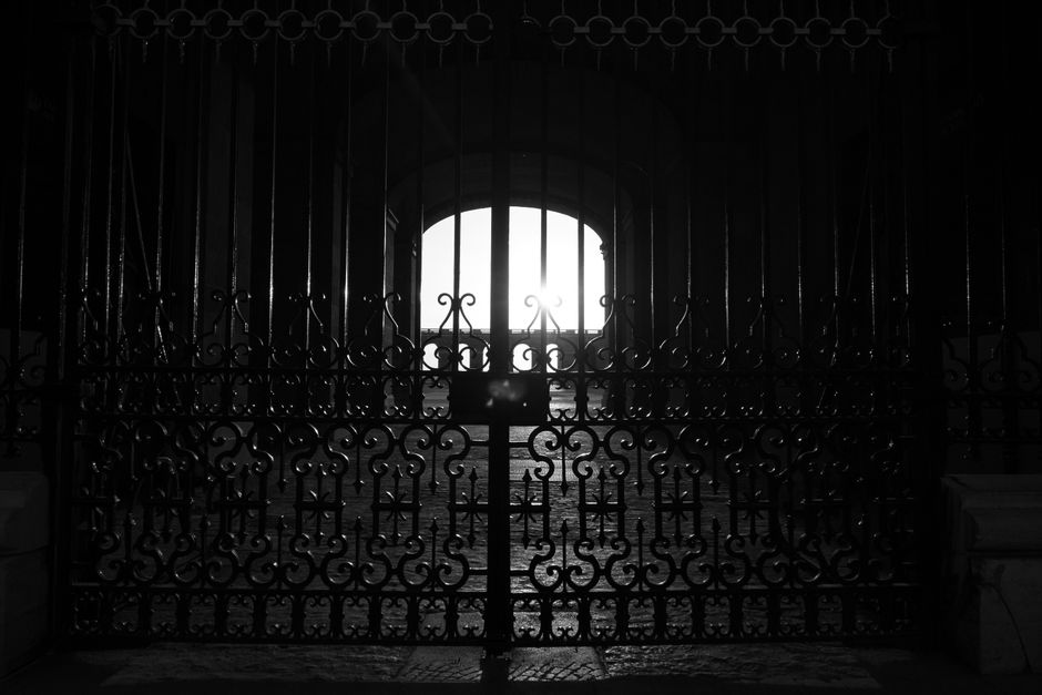 A metal gate with a powder coat finish and a latch on the post.